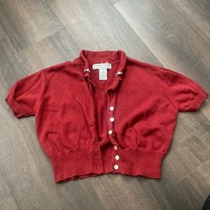 Red cardigan with flower embroidery on front of collar